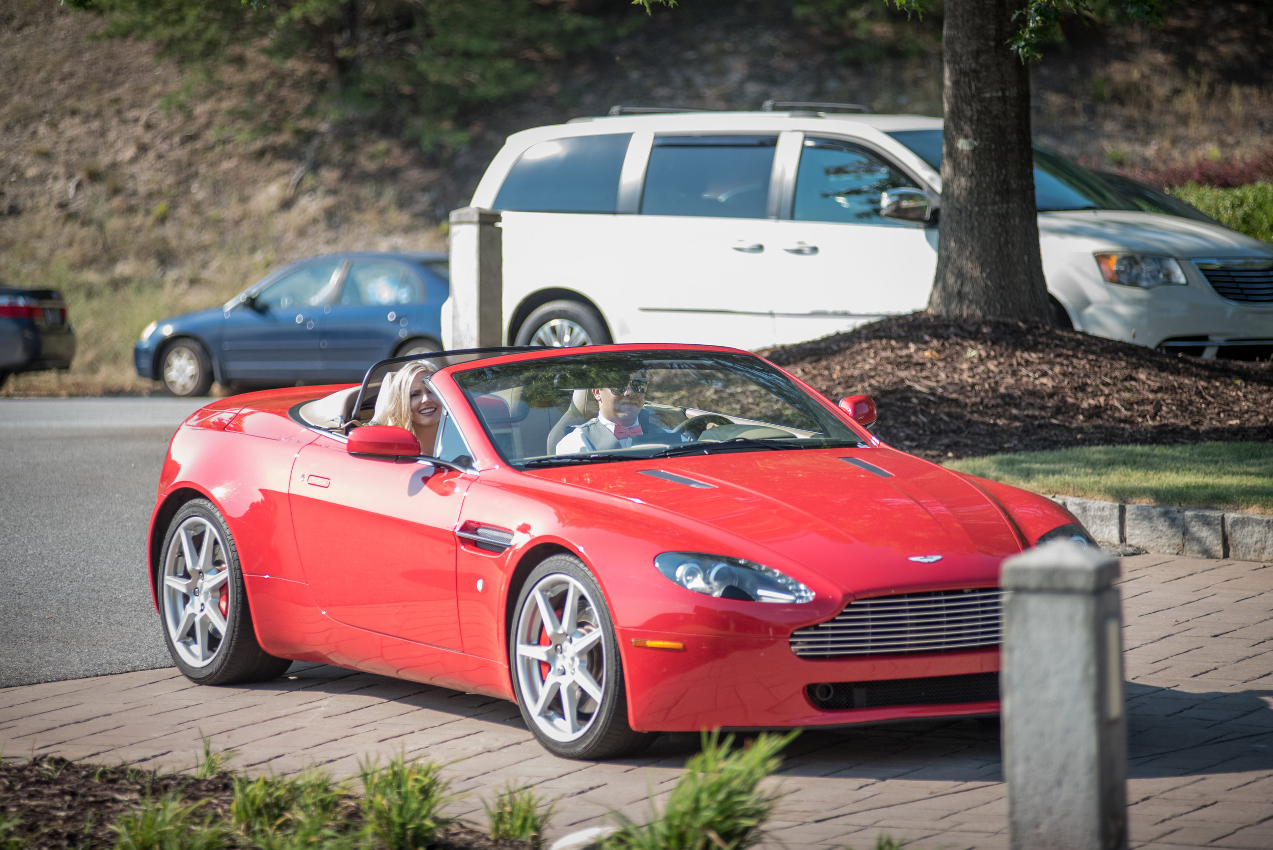  Prior to being introduced into the reception, our couple drove to the Lakehouse in style in a beautiful Aston Martin V8 Vantage Convertible. 
