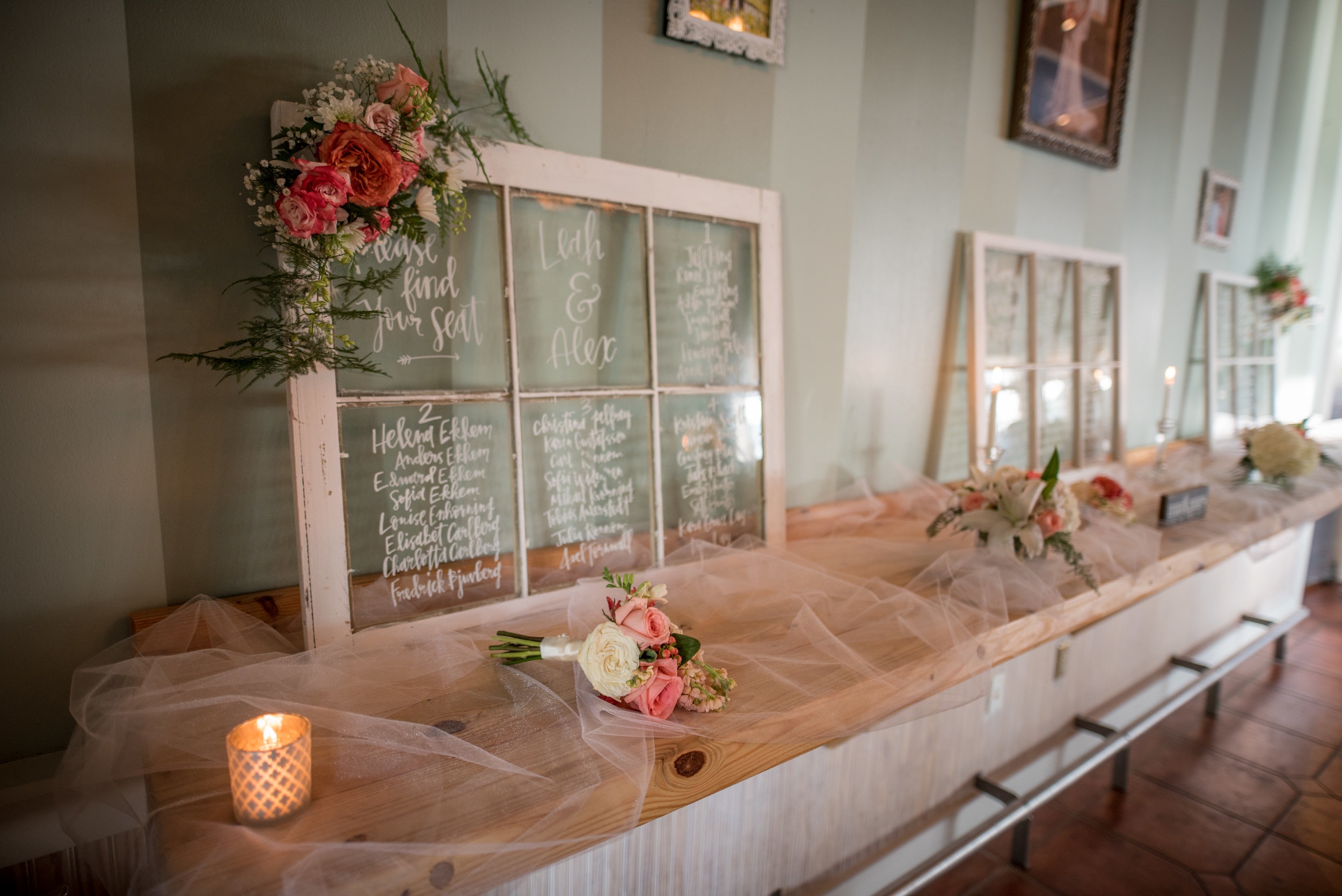  Instead of individual place cards, Leah &amp; Alex wrote their guests' seating locations on beautiful old windows. 