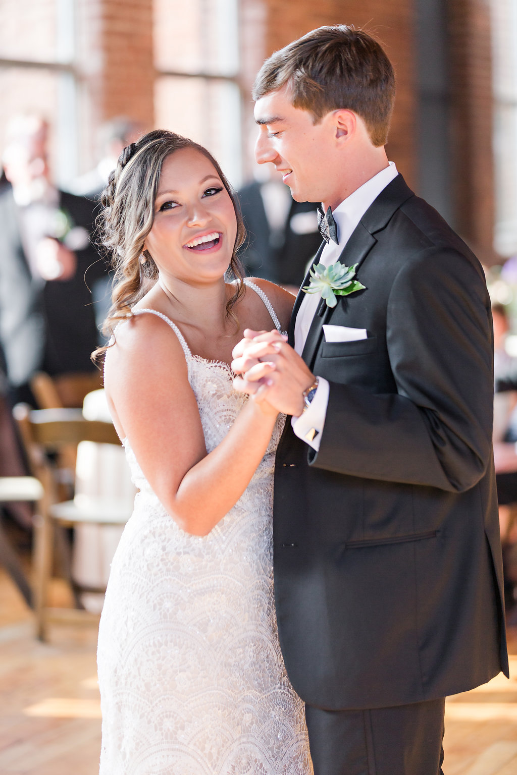  Their first dance was to Tom Petty's "Wildflowers". A unique and perfect song for their first dance. 