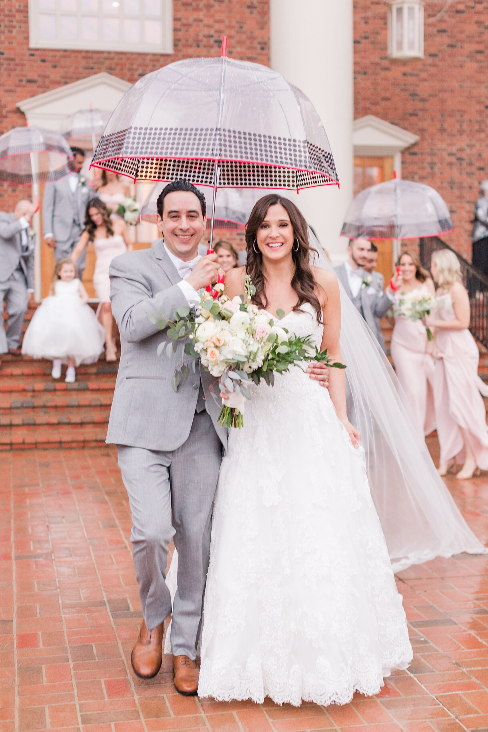  A couple rain showers weren’t going to put a damper on Amy and AC’s wedding day. 